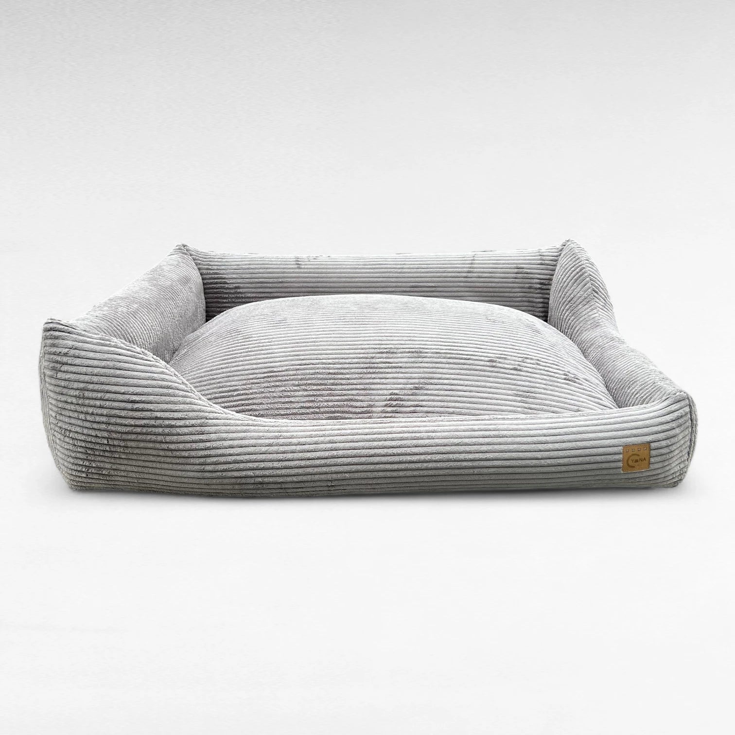 Frontansicht rechteckiges Hundebett mit asymmetrischem Polsterrand aus grauem Breitcord