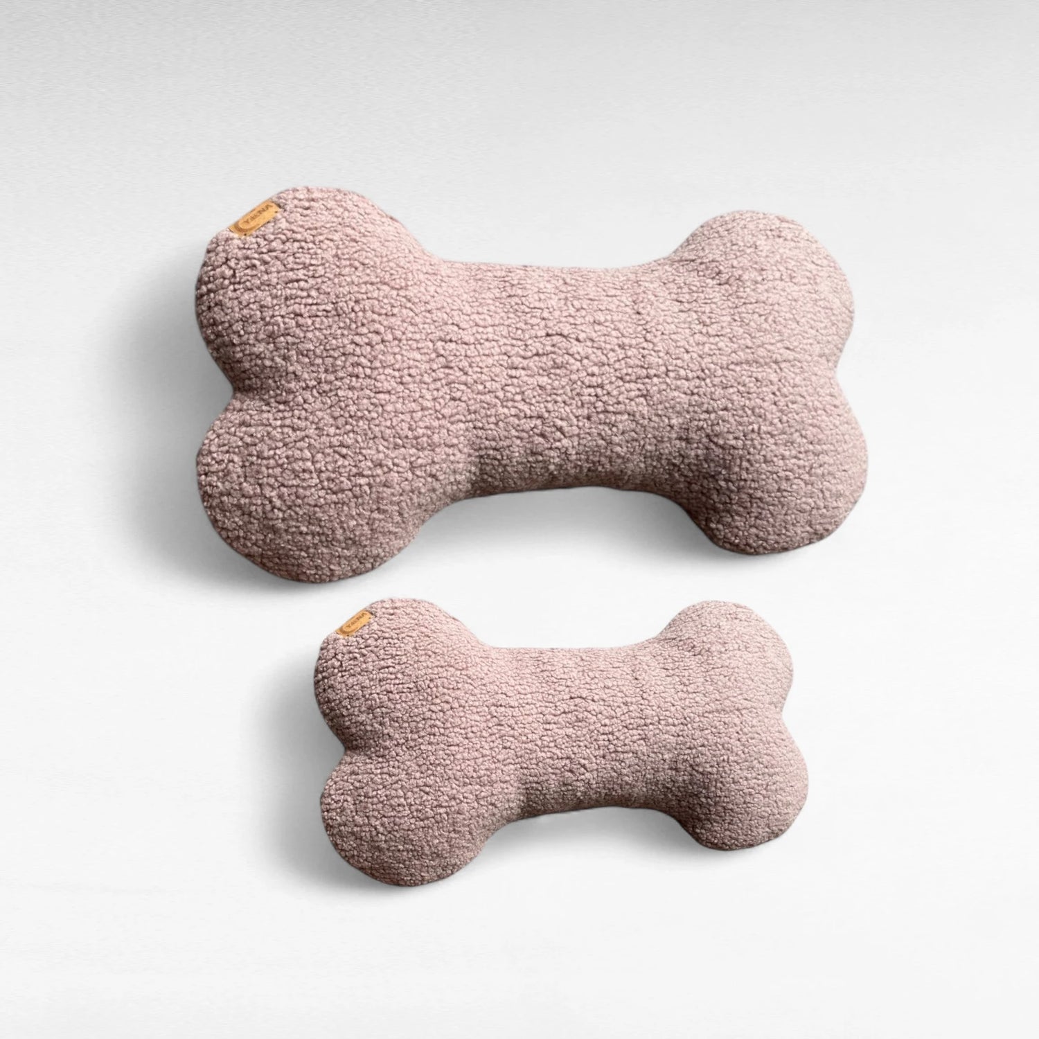 Hundekissen in Knochenform aus Boucléstoff in altrosa