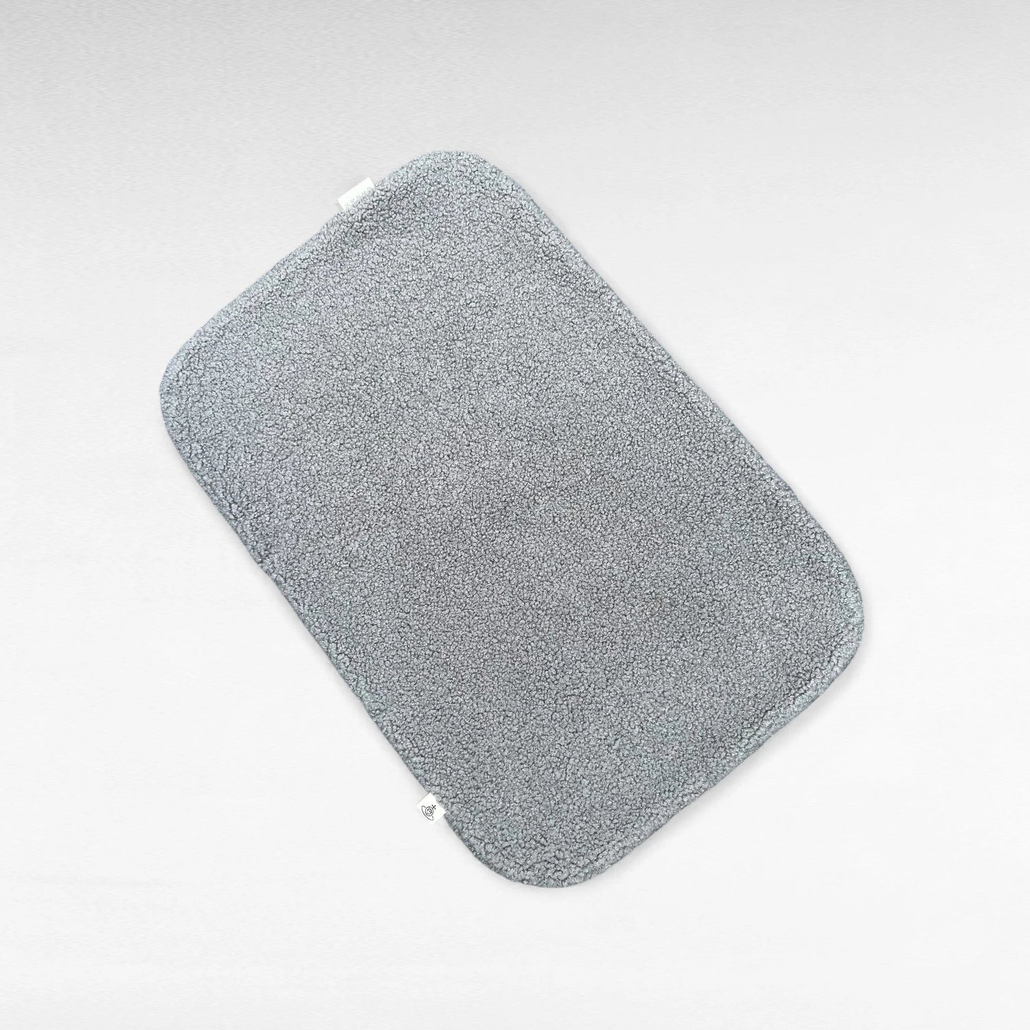 Rechteckige Hundedecke aus flauschigem Bouclé Stoff mit abgerundeten Kanten in grau