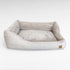 Frontansicht rechteckiges Hundebett mit asymmetrischem Polsterrand aus beige farbenen Breitcord 