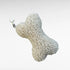 Knochenförmiges kleines Boucle-Kissen mit Karabinerhaken als Taschenanhänger in Farbe beige